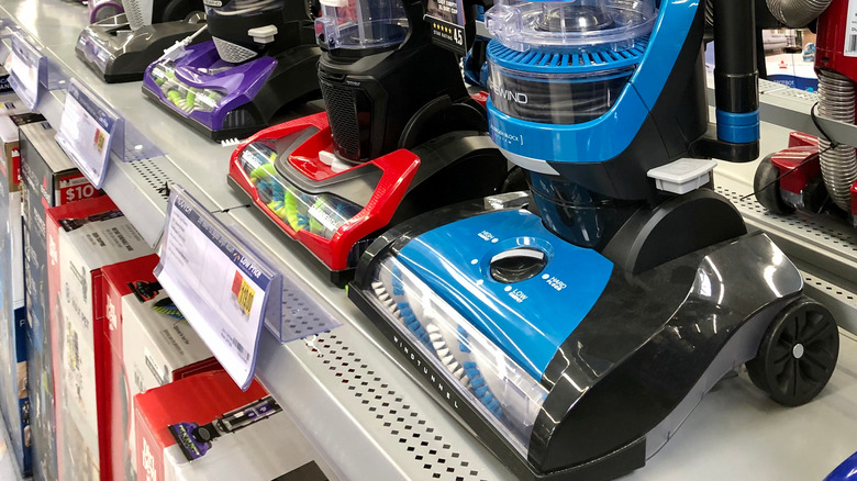 Vacuum cleaners on store shelf