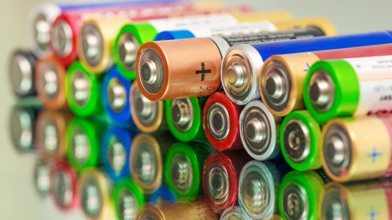 Different colored batteries on table