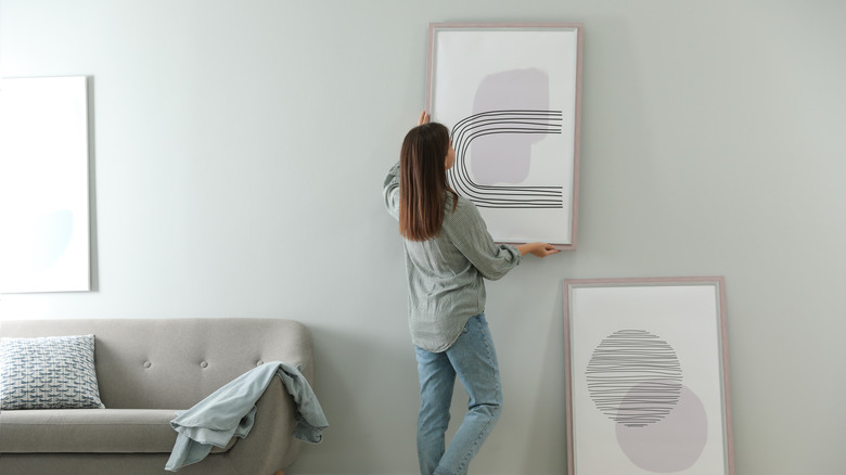 woman hanging wall art