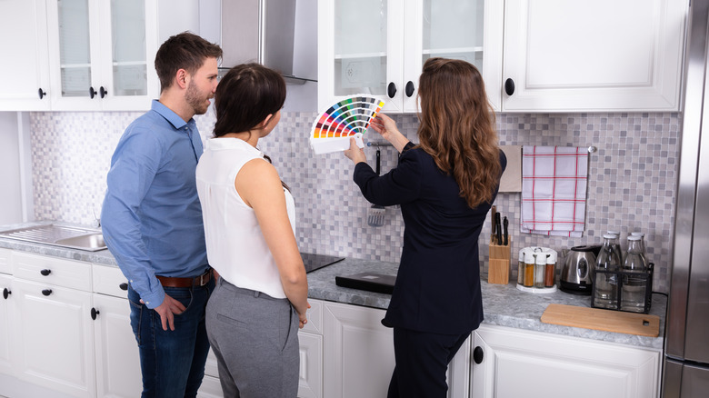 paint swatches in white kitchen