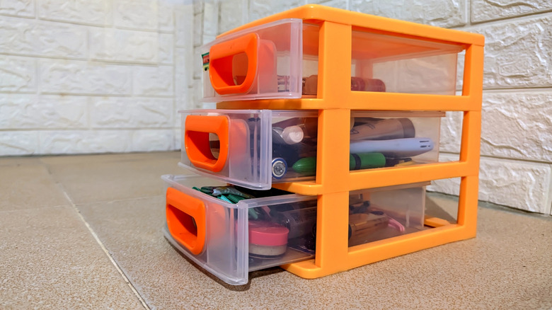 Orange plastic storage drawers