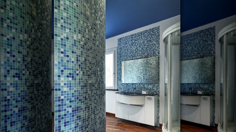 blue ceiling in tiled bathroom