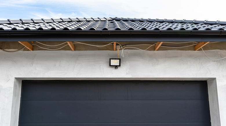 Motion sensor light above a garage door
