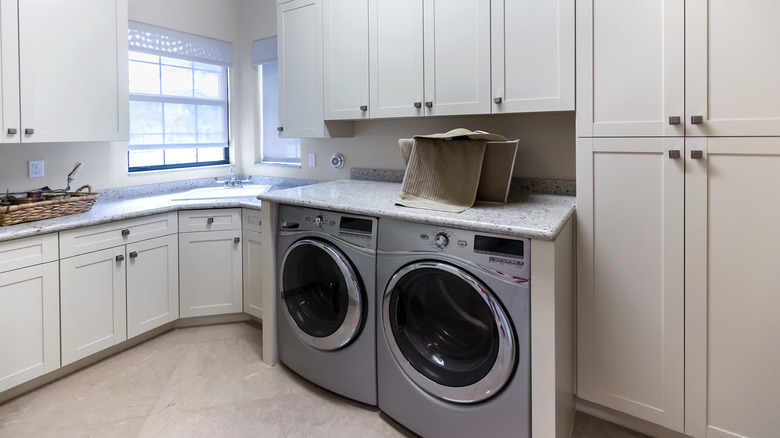 Laundry room with cabinets