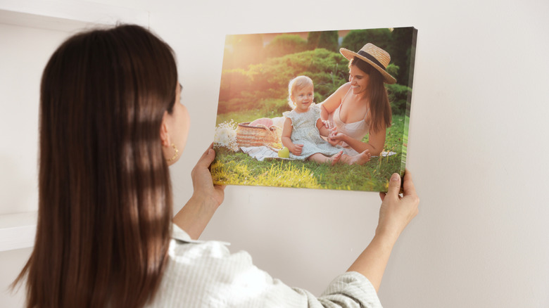 Woman hanging personal photo