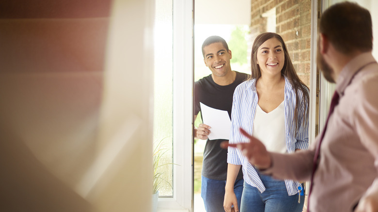 Realtor welcoming prospective buyers