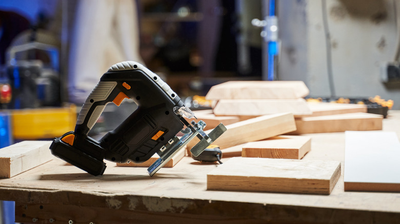 Power tool with battery left on workbench