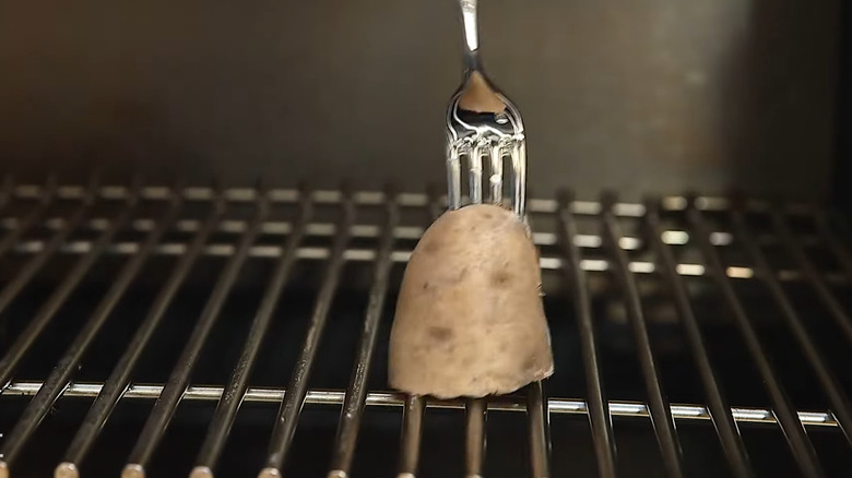 a potato on a fork is the way to make your grill non-stick