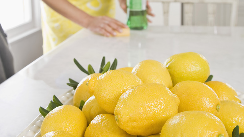 Woman cleaning with lemons