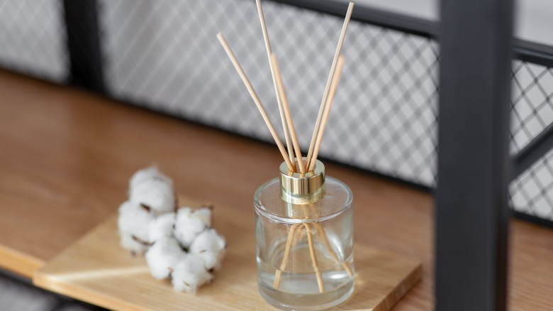 Reed diffuser on shelf