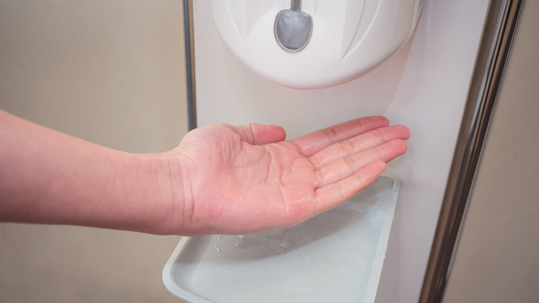 man washing hands with soap