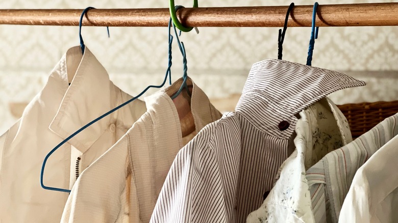 shirts hanging on wire hangers