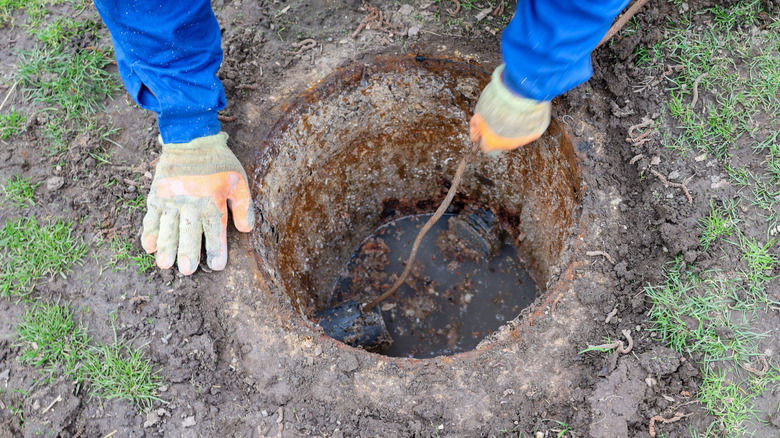 Person working on an old septic system