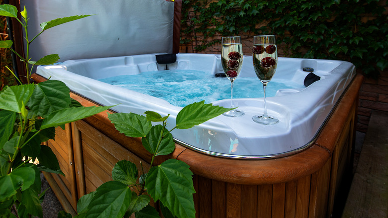 Hot tub with glasses of champagne