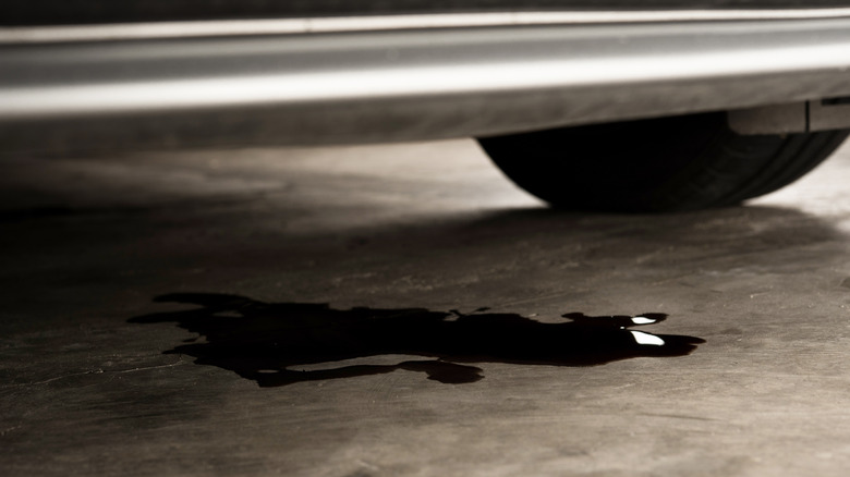 Car leaking oil on concrete floor