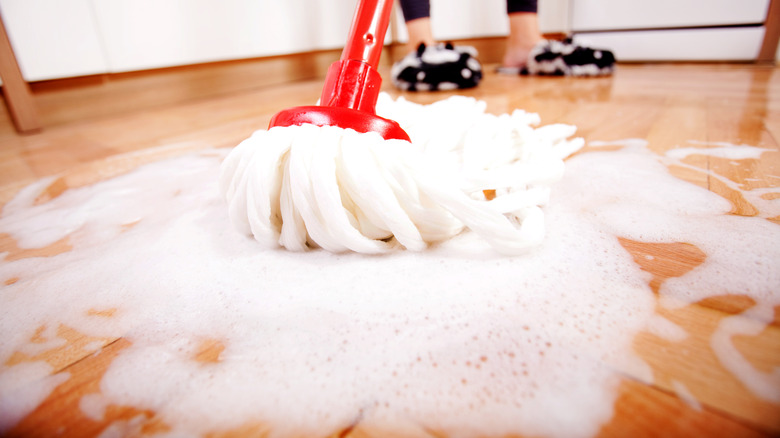 Soapy mop on kitchen floor 