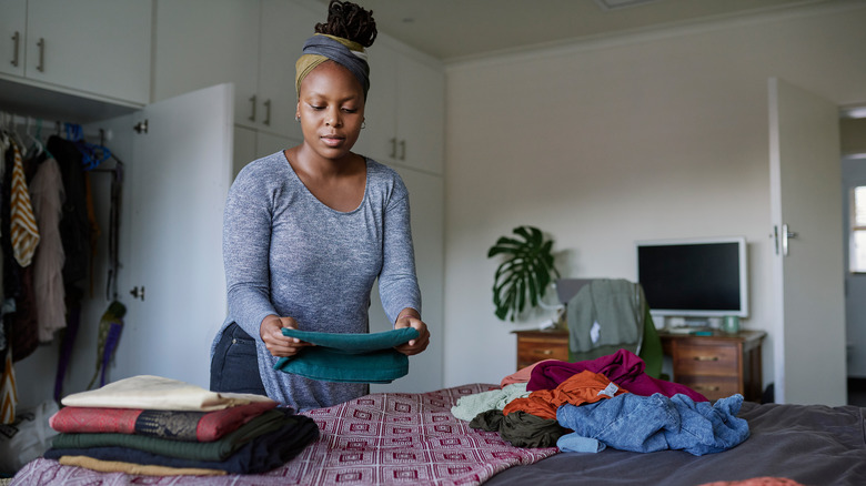 Woman sorting laundry