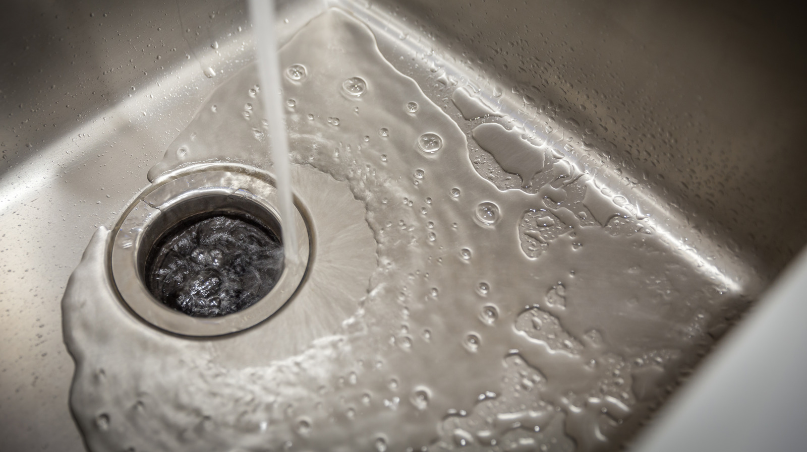 Why You Should Use Orange Peels To Clean Your Garbage Disposal
