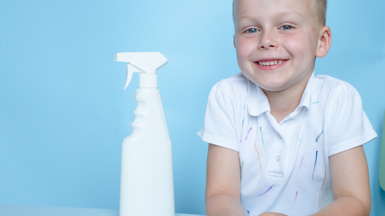 child with marker on shirt