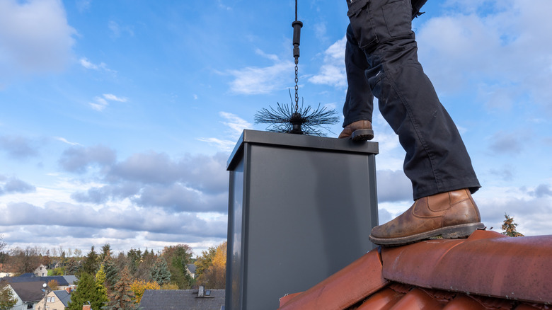 person cleaning chimney