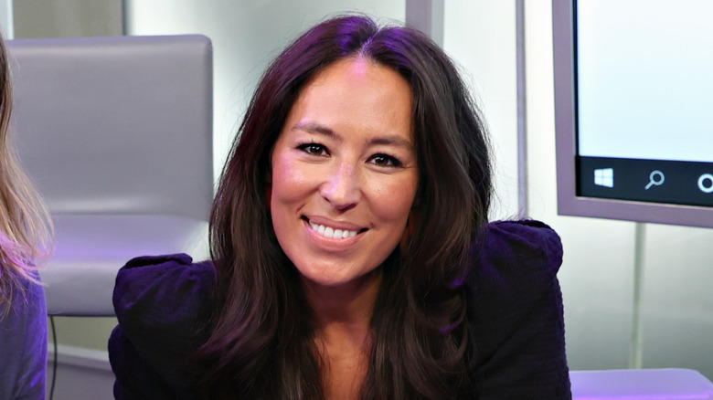 A press headshot of Joanna Gaines smiling.