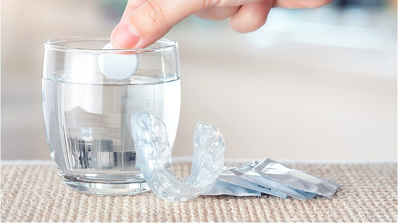 Denture tablets in glass