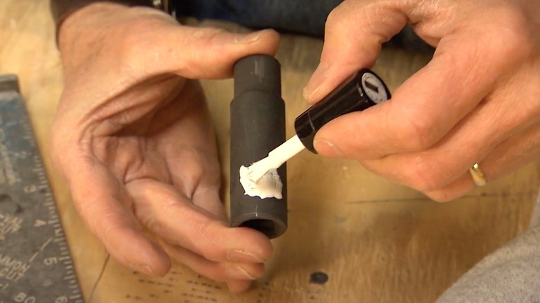 Man painting tool with nail polish