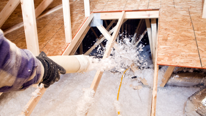blowing insulation inside attic