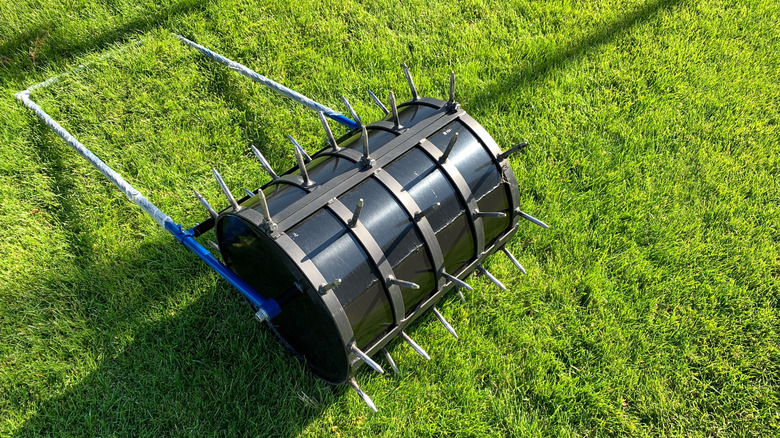 Spike areator laying on lawn