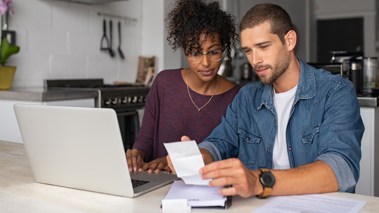 Couple examining bills