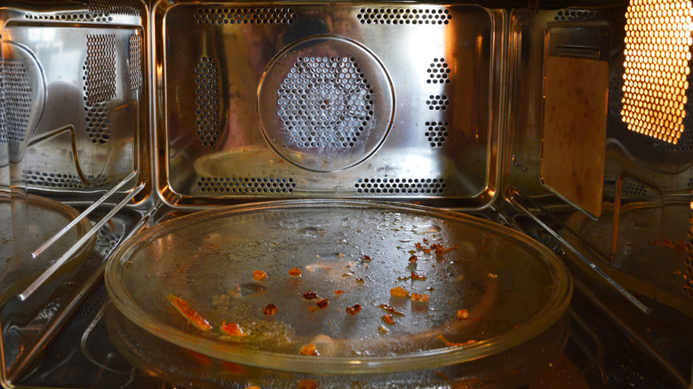 The inside of a dirty microwave