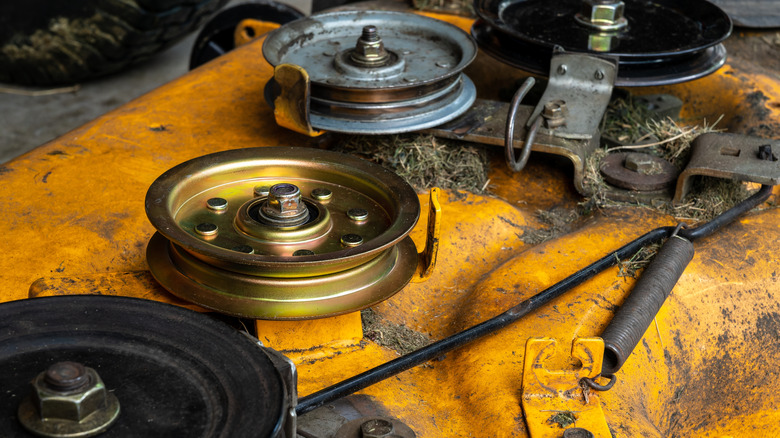 Lawn mower deck and belt pulleys