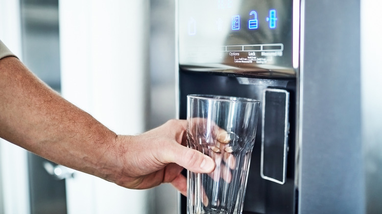 fetching water from fridge