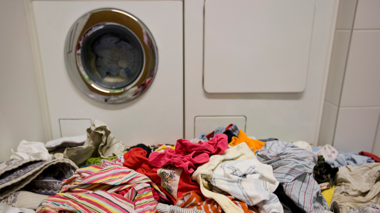 Pile of laundry by washer