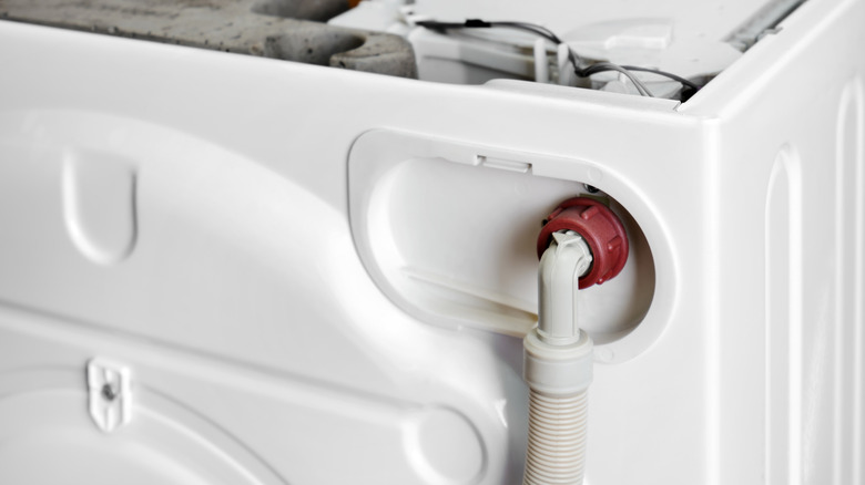 The inlet hose on the back of a washing machine