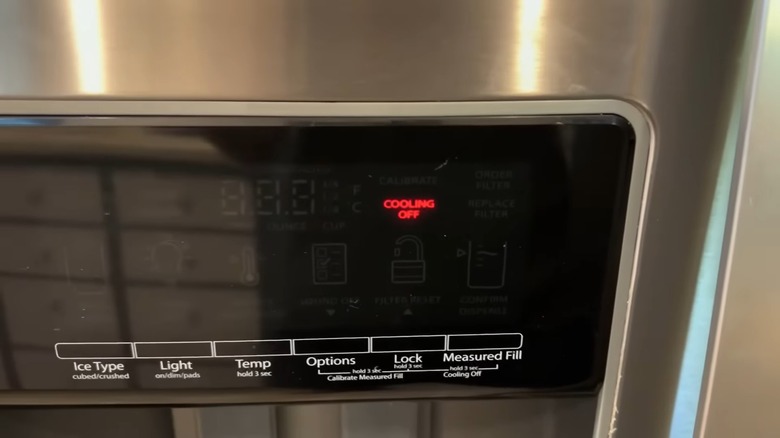 Whirlpool refrigerator with the "cooling off" indicator light on