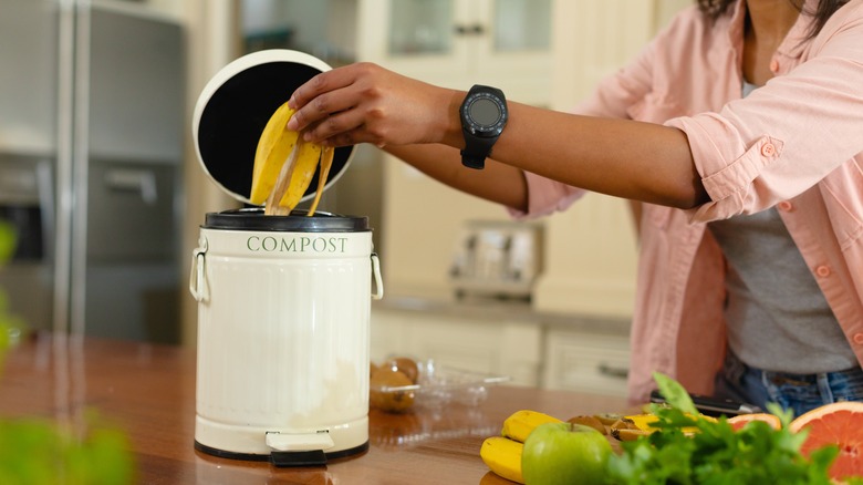 placing banana peel in countertop compost bin