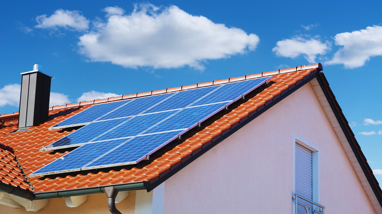 Solar panels on the tile roof of a house