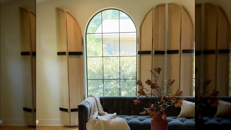 Arched wooden bifold shutters