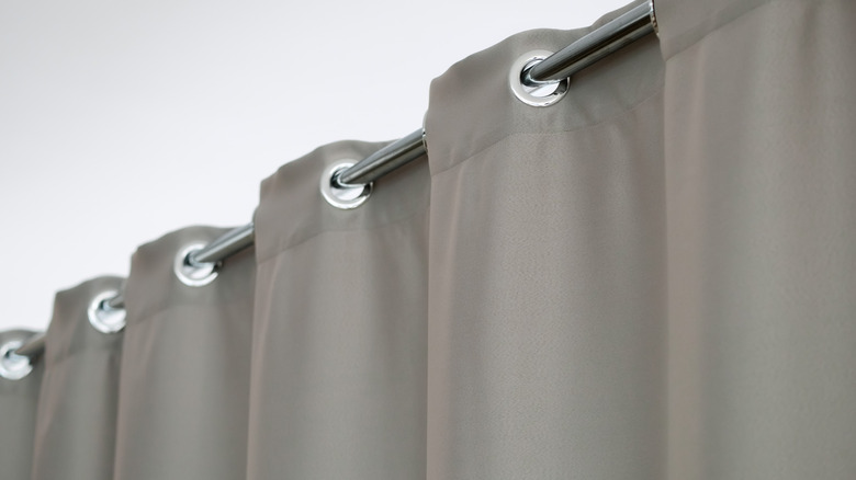 Grey curtains with silver grommets