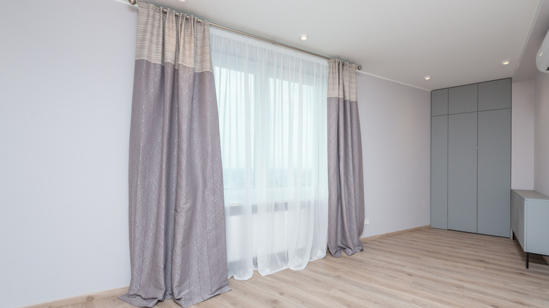 Long curtains that puddle on the ground.