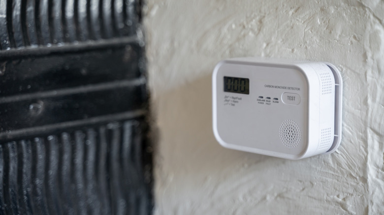 Carbon monoxide detector mounted to a wall