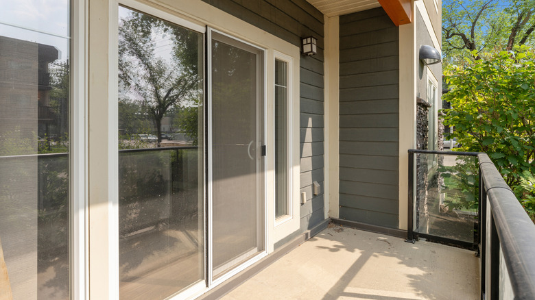 Sliding glass door by patio