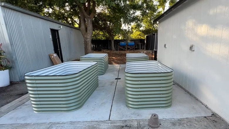 vego garden kit in olive green set up on a concrete patio