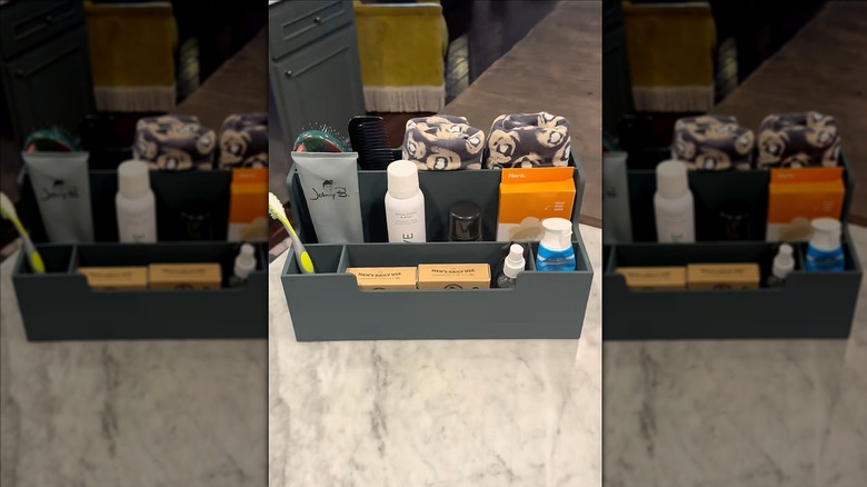 A thrifted desk organizer flipped into a bathroom organizer.