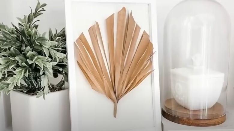DIY palm leaf wall art from Dollar Tree supplies.