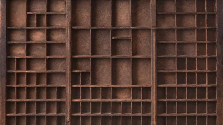 An antique wood printer tray