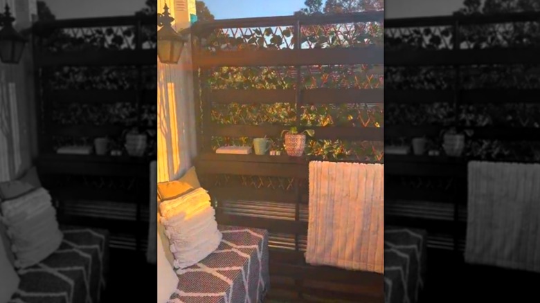 A privacy wall made from a bed frame