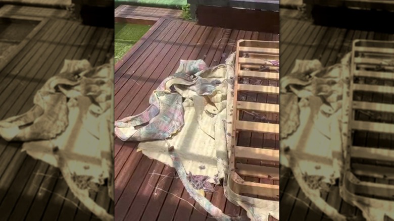 A bed foundation with the fabric partially removed