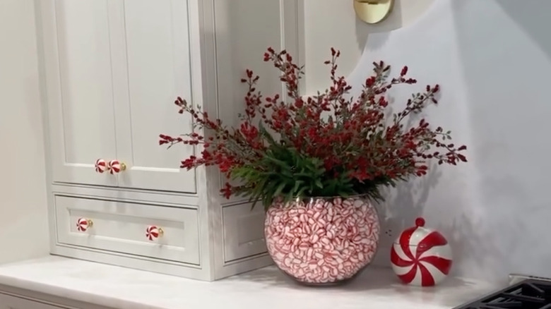Candy bowl filled with mints and winter foliage